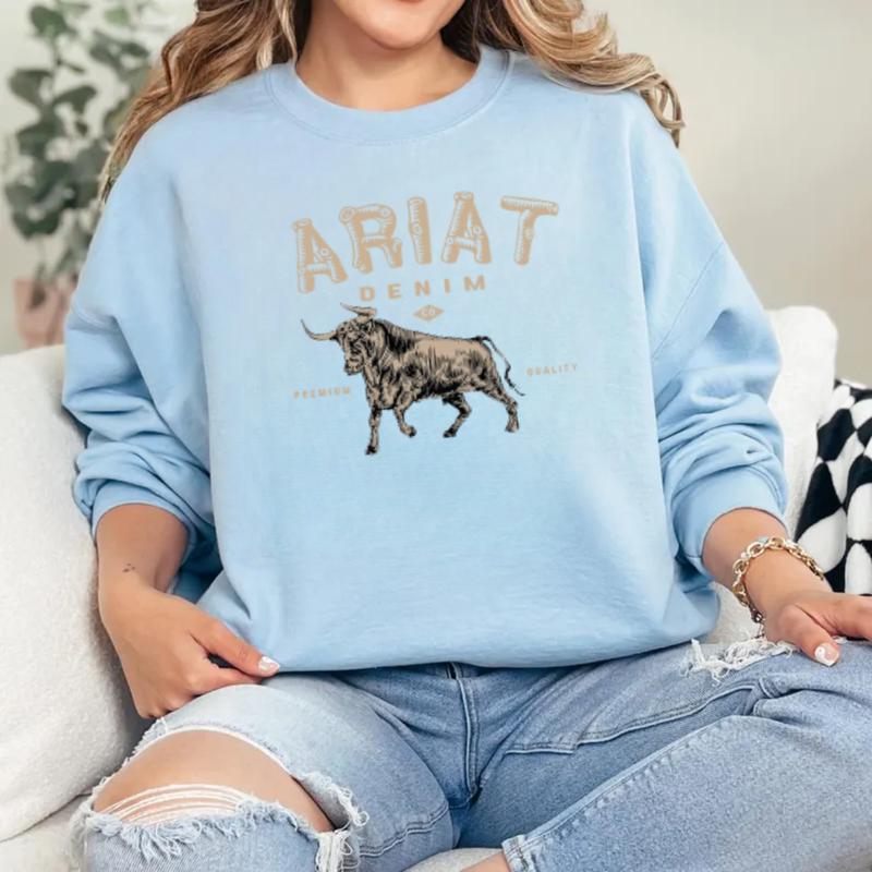 Ariat Denim - Premium Quality Sweatshirt - A stylish design featuring a bold bull graphic, perfect for those who appreciate western fashion and rugged style, unisex.